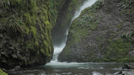 boulders at the base of a waterfall
