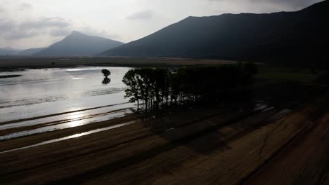 Aerial-view-of-Lake-Stymphalia,-located-in-the-north-eastern-part-of-the-Peloponnese,-in-Corinthia,-southern-Greece,-where-Hercules-shot-down-the-Stymfalian-Birds-according-to-the-ancient-myth