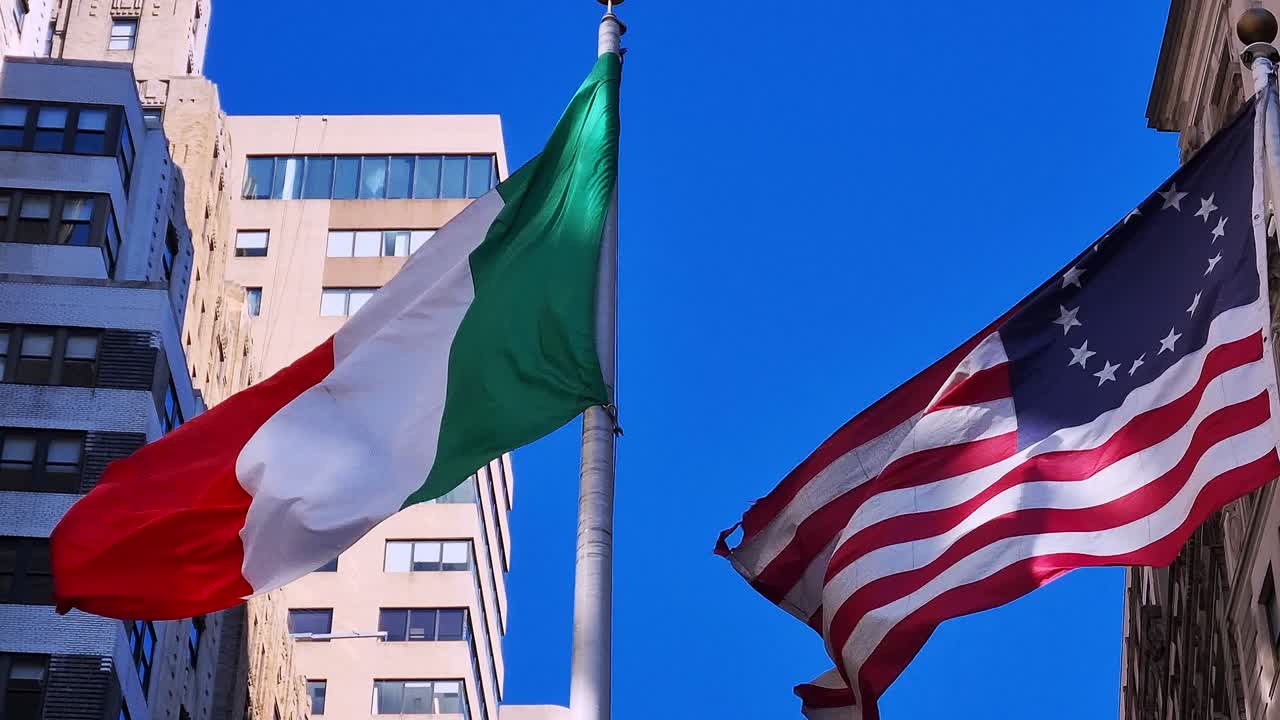 Italian and American flags fluttering in the wind in New York