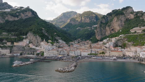 Aerial:-Panoramic-drone-shot-of-Amalfi-village-in-Italy