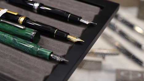 Exploring-the-Artistry-of-Fountain-Pens,-Fountain-pens-are-on-display-for-sale