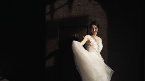 bride in a wedding dress by an ancient door