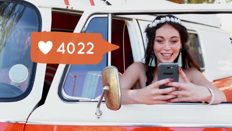Hippie-leaning-on-a-van-door-while-texting-4k