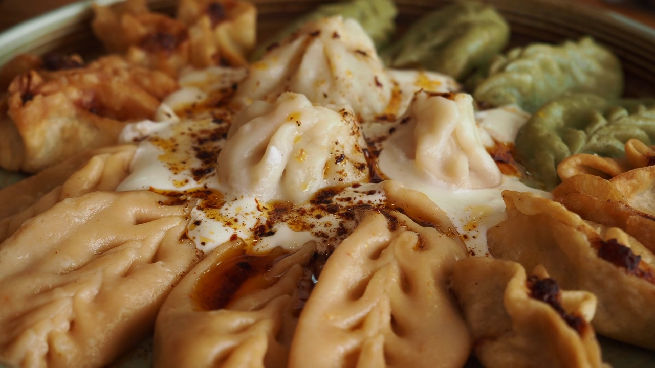 Assortment of Traditional Dumplings with Sauce and Chili Oil