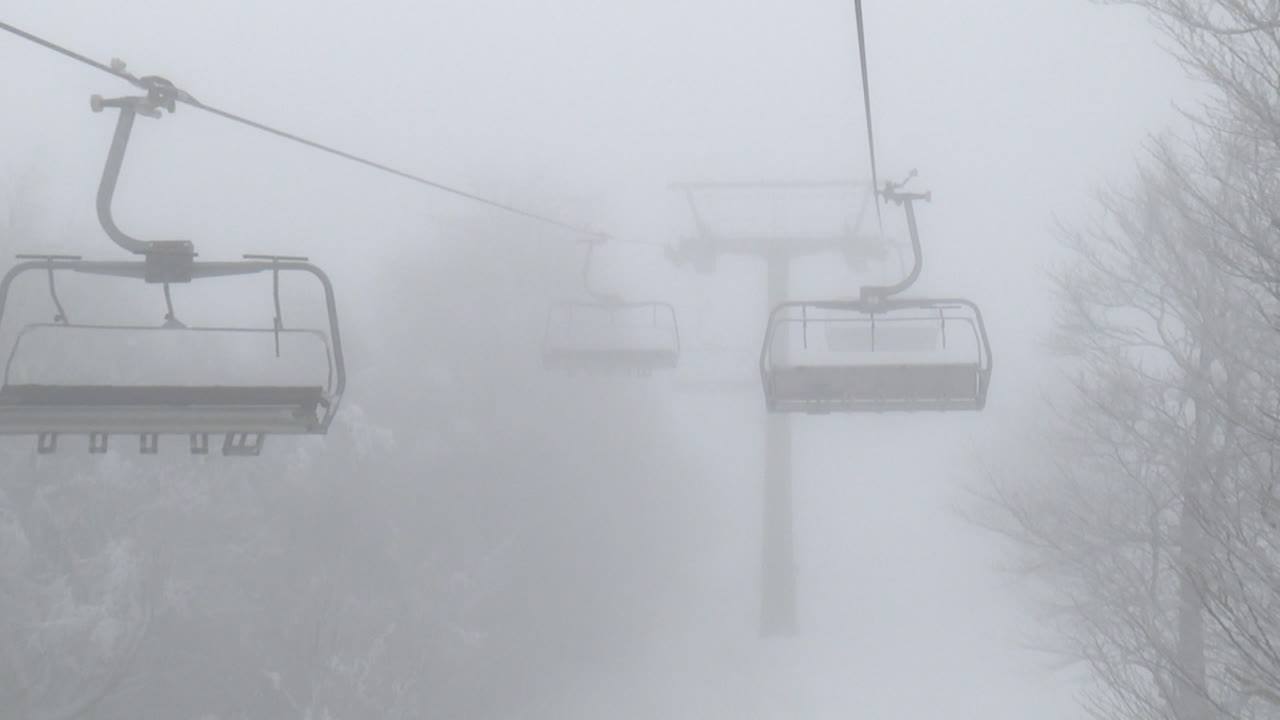 Foggy Ski Lift in the Mountains