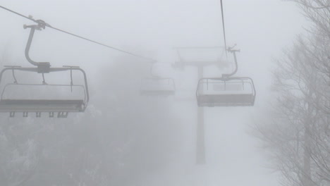 foggy ski lift in the mountains