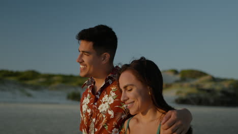 cute couple walking on the beach