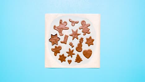 baking gingerbread cookies animation. shaping cookies stop motion. making christmas cookies flat lay video