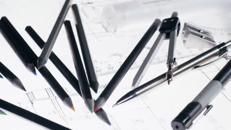 pencils and design tools on blueprints