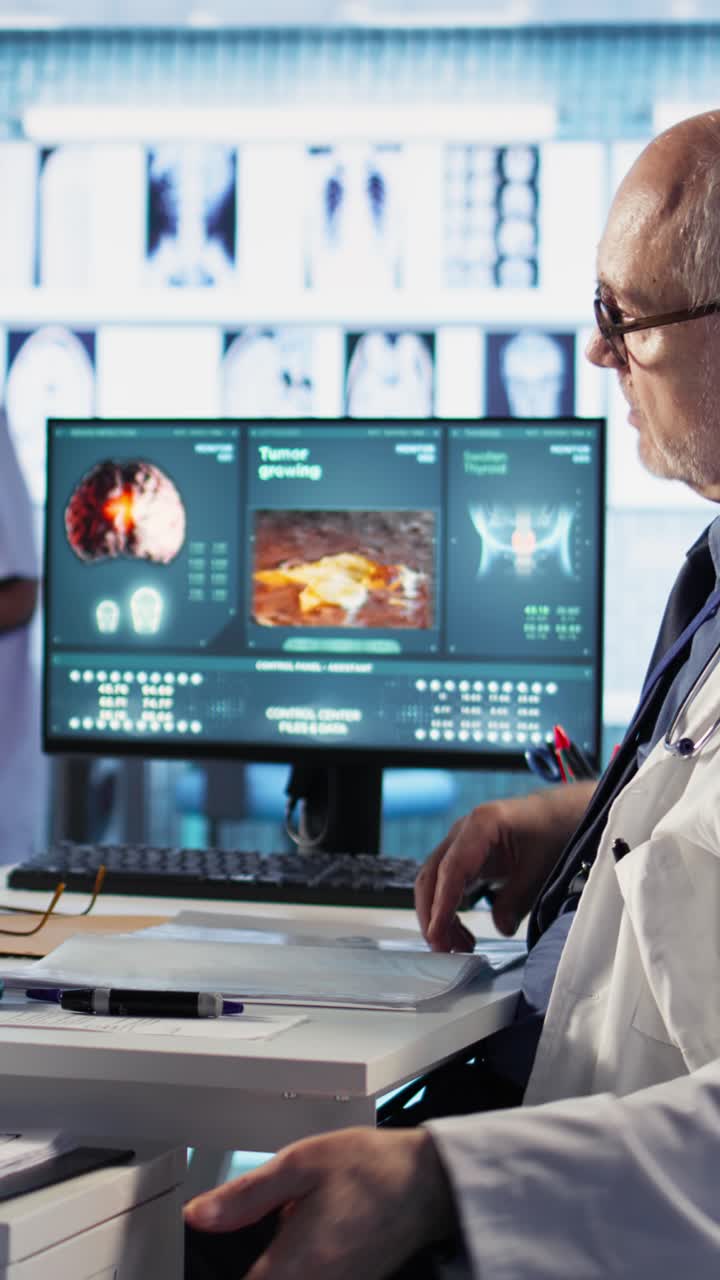 Doctor reviewing medical images and discussing patient case.