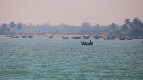 Many-boats-and-the-coastline,-St