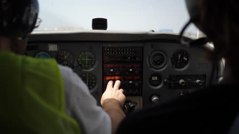 pilot testing controls on a plane