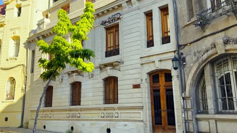 POV-walking-shot-in-front-of-traditional-architecture-of-sunny-Santiago-de-Chile