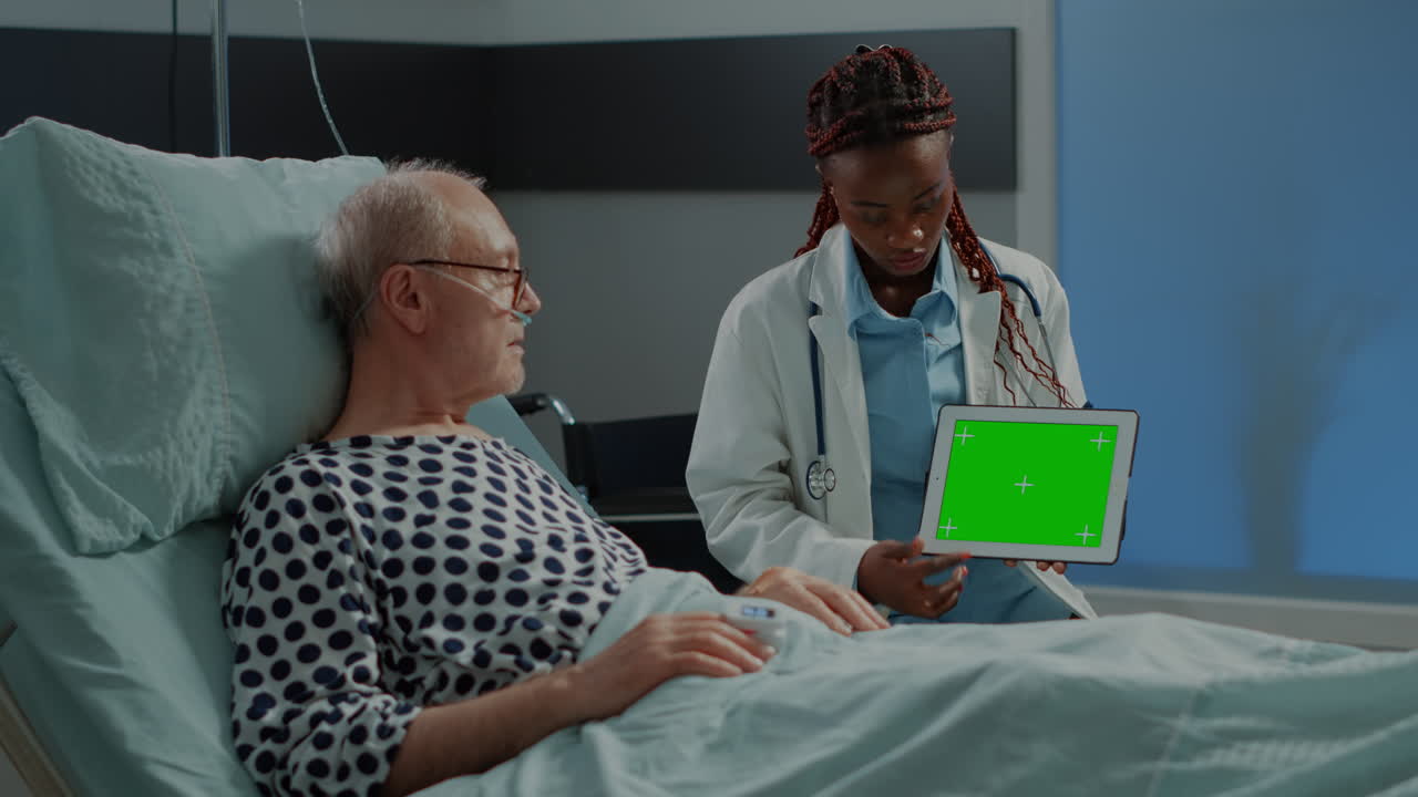 African american medic showing greenscreen on tablet