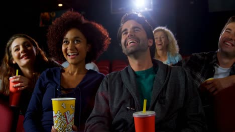 group of people watching movie in theater 4k