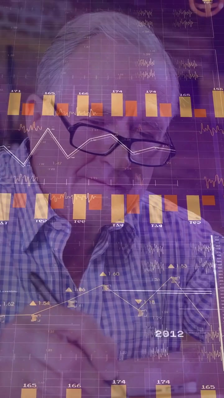 Vertical video: Analyst glancing laptop starting finance charts moving over face while noting data