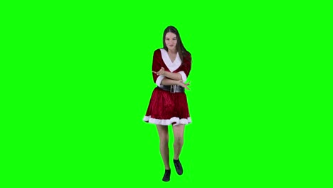 mujer despreocupada y vivaz bailando frente a la pantalla verde xmas navidad víspera de navidad mujer celebrar el año nuevo sentirse viva y feliz fiesta