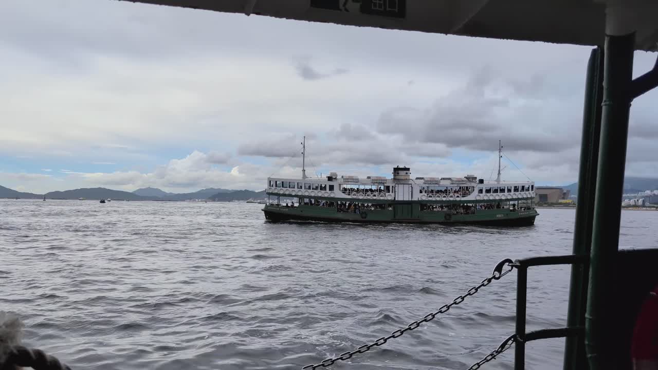 Star Ferry Crossing View from Inside Hong Kong Ferry as another ferry passes by