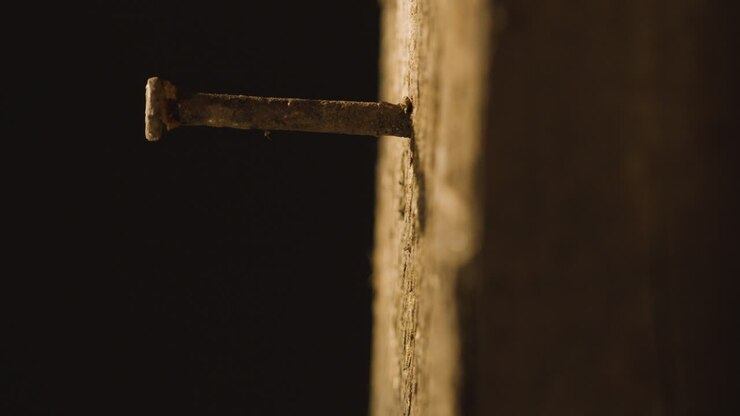 Religious Concept Shot With Close Up Of Old Rusty Nail In Wooden Cross 1