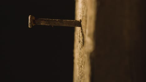 religious concept shot with close up of old rusty nail in wooden cross 1