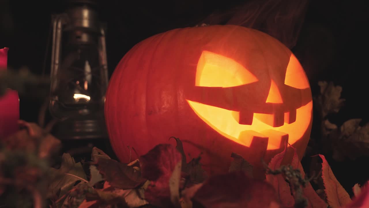 Glowing jack o lantern with light inside the perfect spooky Halloween scene