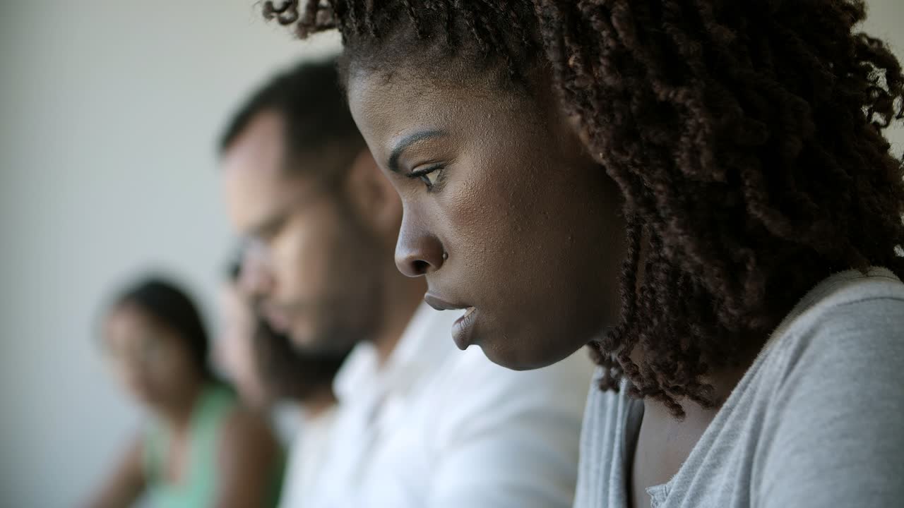 Closeup shot of focused young woman typing on laptop