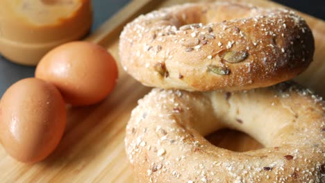 bagel and paper packet on white background