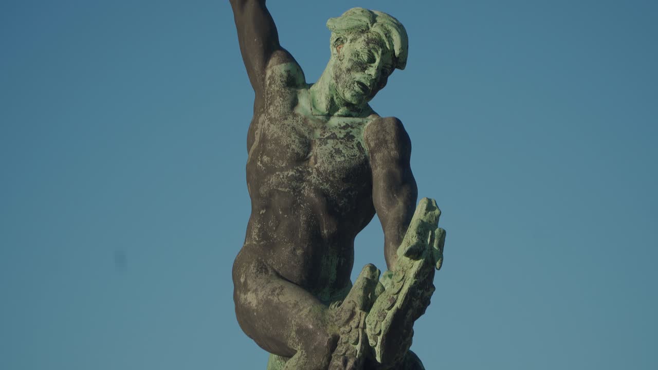 The Libert And Freedom Statue at the Citadel on Gellert Hill in Budapest With Clear Blue Sky Above - Tilt Up Shot