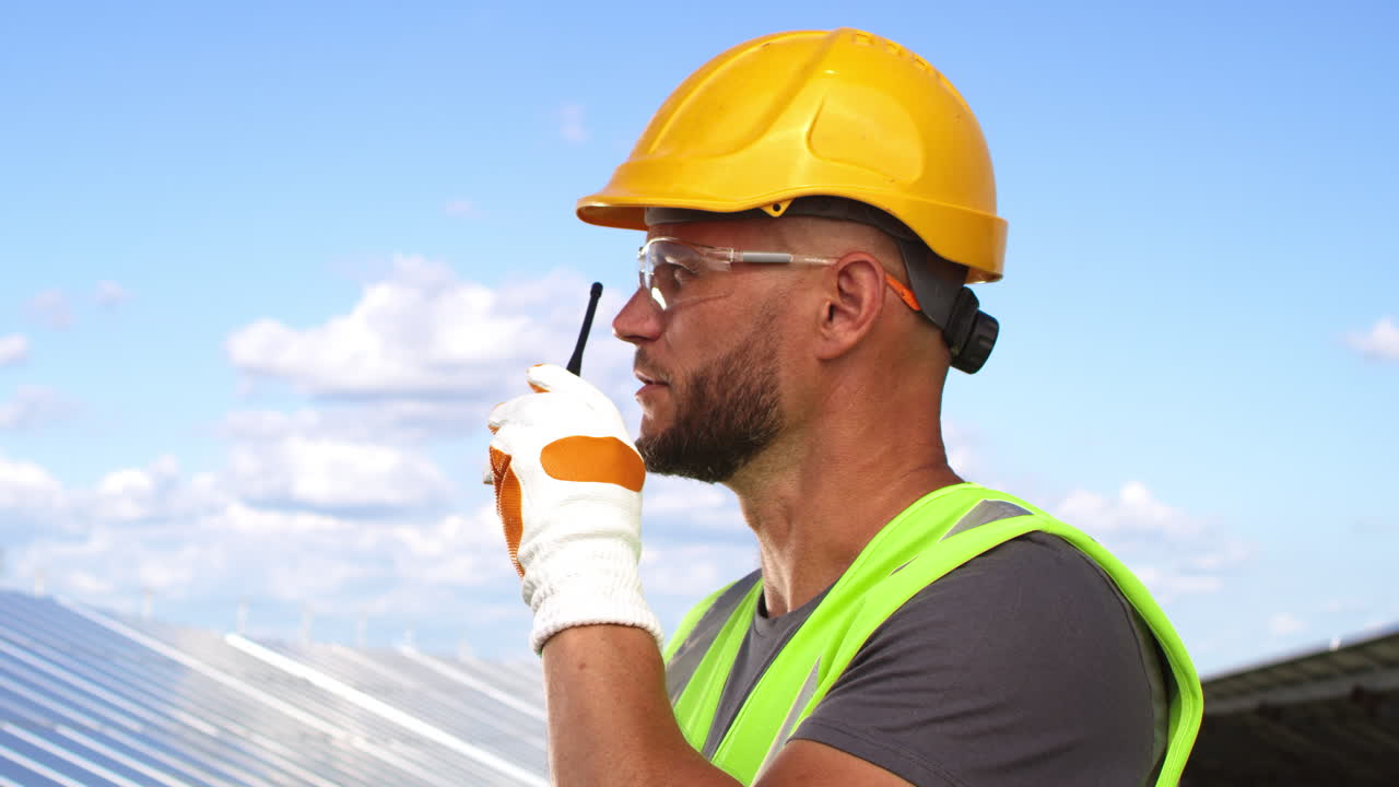 Construction worker communicating at a solar panel site
