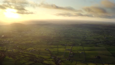 wintery sunset at ring of gullion, newry, northern ireland. december 2019. drone slowly pushes forward from slieve gullion facing west towards mullaghbane.