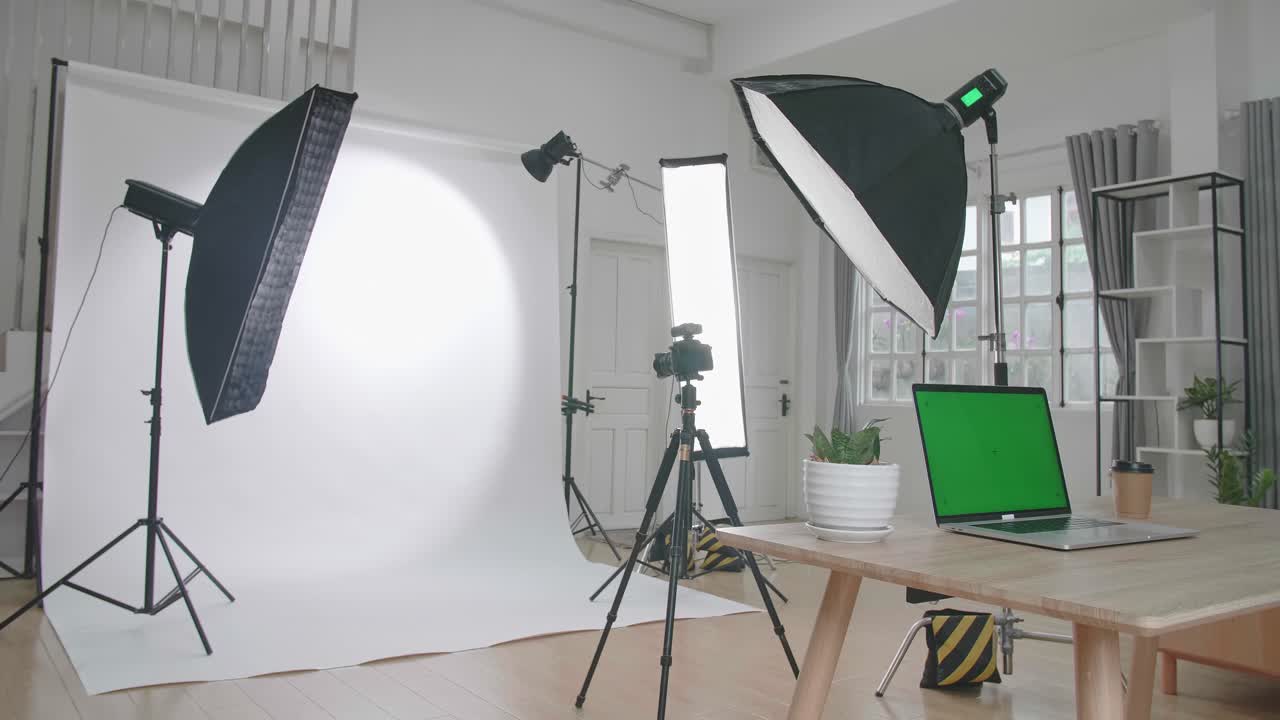 Photo Studio With Professional Equipment And Green Screen Laptop Computer Display