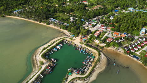 slow aerial birds eye rotation over the beautiful wok tum canal viewpoint and marina in koh phangan, surat thani, thailand