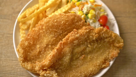 fish and chips with mini salad on white plate