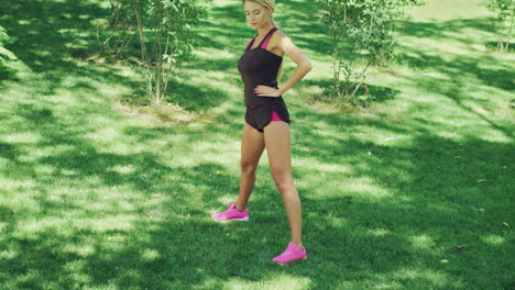 sport woman doing slope and stretching exercise at outdoor gym in summer park