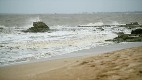 beautiful waves on the sea coast, breaking about stones, diu india