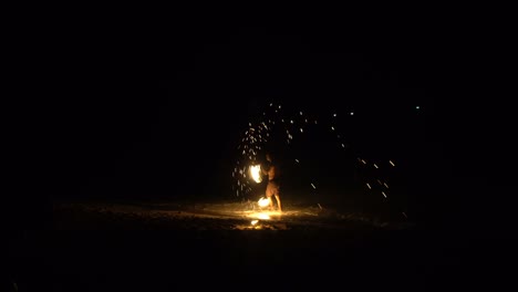 beautiful fire show at night on the beach. koh larn. thailand. the fire show takes place every night.