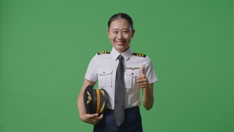 woman pilot smiling with thumbs up