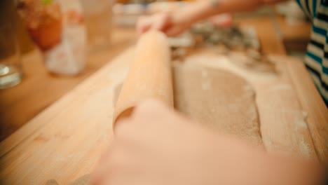 Spreading-the-fresh-made-cookie-dough-with-a-rolling-pin-in-slow-motion