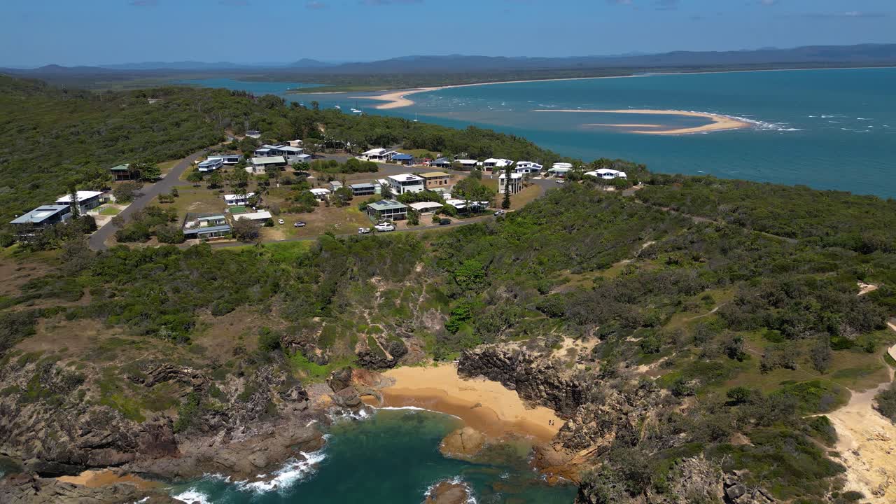 Forward moving aerial views over the Town of 1770, Central Queensland, Australia