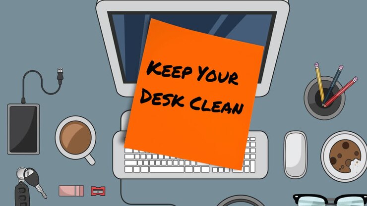 Animation of keep your desk clean text on orange memo note over desk on grey background