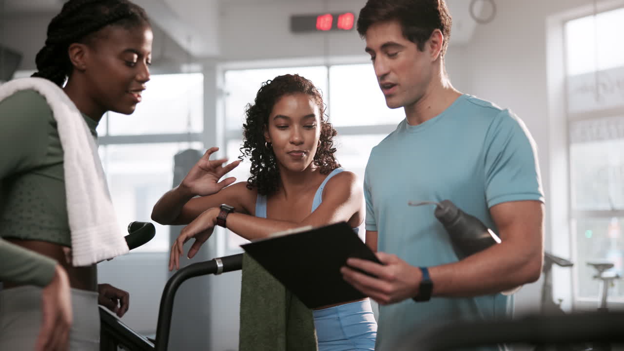 Trainer instructing clients at the gym