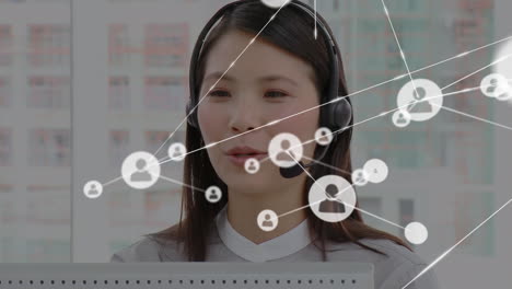 animation of network of connections and icons over businesswoman wearing headset