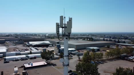 Flying-Around-the-Mobile-Cell-Tower-Within-Industrial-Area-in-Calgary,-Alberta