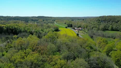 along a country road in rural south west france, a drone illuminates the beauty of dordogne's lush region and never ending fields of crops