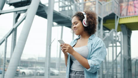 young woman using phone outdoors