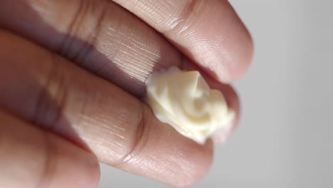 close-up of hand with cream
