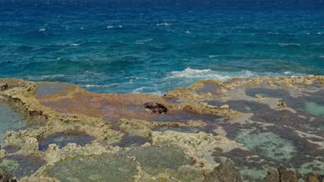 a rainbow showing on blow hole in tinian, northern mariana islands