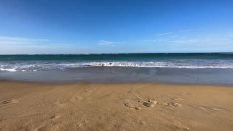 intersecting-Caribbean-waves-as-they-roll-onto-the-beach-in-Dominican,-Punta-Cana,-Hispaniola