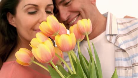 Loving-couple-with-a-bunch-of-flowers
