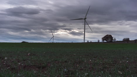Wind-turbine-moving-timelapse-day-to-night-transition-wheat-field